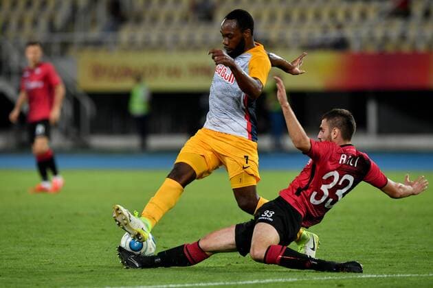 SOCCER - UEFA CL quali, Shkendija vs RBS SKOPJE,MACEDONIA,14.AUG.18 - SOCCER - UEFA Champions League, qualification, KF Shkendija vs Red Bull Salzburg. Image shows Reinhold Yabo (RBS) and Mevlan Adili (Shkendjia). GEPAxpictures xFlorianxErtl