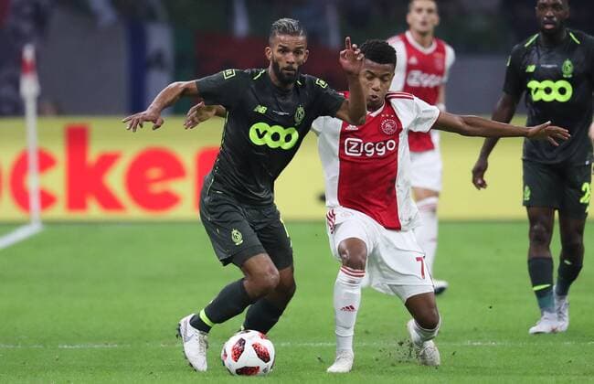 Standard s Mehdi Carcela and Ajax David Neres fight for the ball during a soccer game between Dutch club AFC Ajax and Belgian team Standard de Liege, Tuesday 14 August 2018 in Amsterdam, the Netherlands, the return leg of the third qualifying round of the UEFA Champions League. The first leg resulted in a 2-2 draw. VIRGINIExLEFOUR  x05405875x