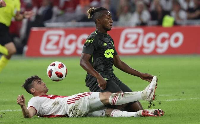 Ajax Nicolas Tagliafico and Standard s Samuel Bastien fight for the ball during a soccer game between Dutch club AFC Ajax and Belgian team Standard de Liege, Tuesday 14 August 2018 in Amsterdam, the Netherlands, the return leg of the third qualifying round of the UEFA Champions League. The first leg resulted in a 2-2 draw. VIRGINIExLEFOUR  x05405893x