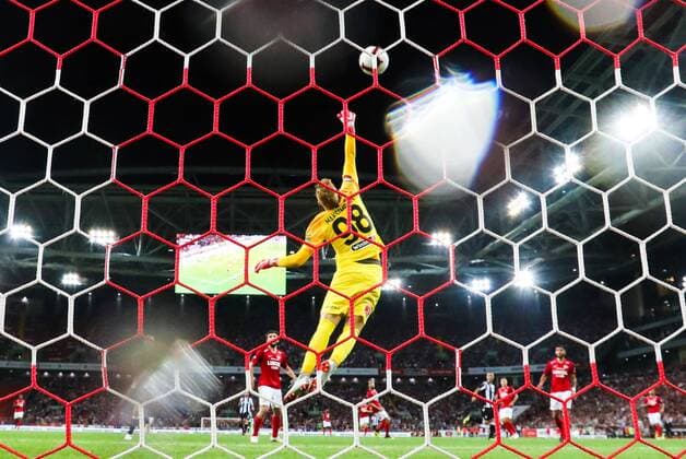 MOSCOW, RUSSIA - AUGUST 14, 2018: Spartak Moscow goalkeeper Alexander Maksimenko makes a save in their 2018-19 UEFA Champions League third qualifying round match against PAOK Thessaloniki at Moscow s Otkritie Arena; the teams drew 0-0. Anton Novoderezhkin TASS  TS08CC61