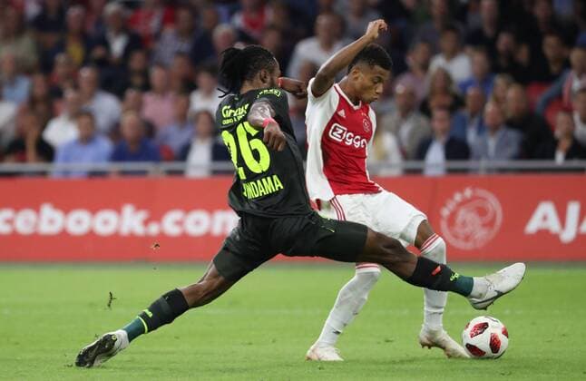 Standard s Christian Luyindama Nekadio and Ajax David Neres fight for the ball during a soccer game between Dutch club AFC Ajax and Belgian team Standard de Liege, Tuesday 14 August 2018 in Amsterdam, the Netherlands, the return leg of the third qualifying round of the UEFA Champions League. The first leg resulted in a 2-2 draw. VIRGINIExLEFOUR  x05405925x