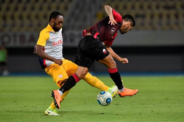 SOCCER - UEFA CL quali, Shkendija vs RBS SKOPJE,MACEDONIA,14.AUG.18 - SOCCER - UEFA Champions League, qualification, KF Shkendija vs Red Bull Salzburg. Image shows Reinhold Yabo (RBS) and Stenio Junior (Shkendjia). GEPAxpictures xFlorianxErtl