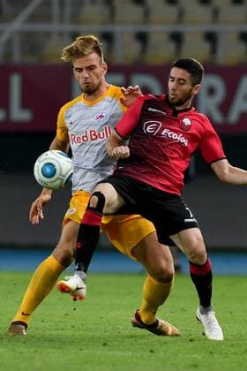 SOCCER - UEFA CL quali, Shkendija vs RBS SKOPJE,MACEDONIA,14.AUG.18 - SOCCER - UEFA Champions League, qualification, KF Shkendija vs Red Bull Salzburg. Image shows Marin Pongracic (RBS) and Besart Ibraimi (Shkendjia). GEPAxpictures xFlorianxErtl
