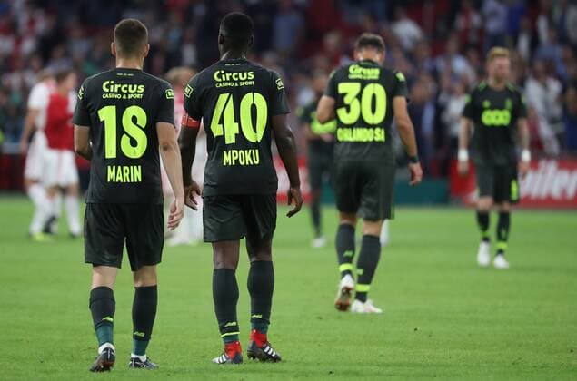 Standard s Razvan Marin and Standard s Paul-Jose Mpoku M Poku Ebunge look dejected after a soccer game between Dutch club AFC Ajax and Belgian team Standard de Liege, Tuesday 14 August 2018 in Amsterdam, the Netherlands, the return leg of the third qualifying round of the UEFA Champions League. The first leg resulted in a 2-2 draw. VIRGINIExLEFOUR  x05405938x
