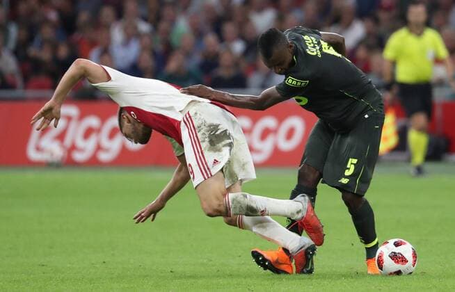 Ajax Klaas-Jan Huntelaar and Standard s Uche Agbo fight for the ball during a soccer game between Dutch club AFC Ajax and Belgian team Standard de Liege, Tuesday 14 August 2018 in Amsterdam, the Netherlands, the return leg of the third qualifying round of the UEFA Champions League. The first leg resulted in a 2-2 draw. VIRGINIExLEFOUR  x05405941x