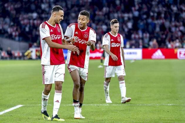 AMSTERDAM, 14-08-2018 , Johan Cruyff-Arena , football season 2018 2019, UEFA Champions League third qualifying round, 2nd leg , Ajax player David Neres (C) and Ajax player Noussair Mazraoui (L) during the game Ajax - Standard Luik (3-0) . Ajax - Standard Luik  x2399247x