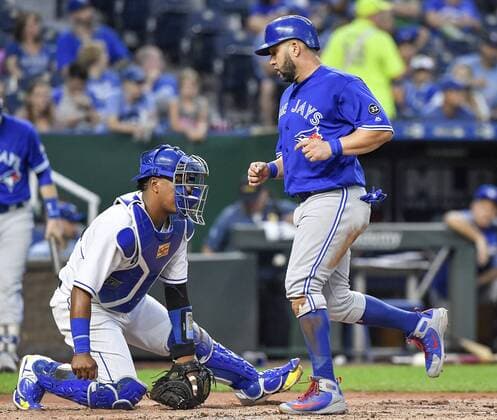 August 14, 2018 - Kansas City, MO, USA - The Toronto Blue Jays Kendrys Morales scores in front of Kansas City Royals catcher Salvador Perez on a single by Kevin Pillar in the second inning on Tuesday, Aug. 14, 2018, at Kauffman Stadium in Kansas City, Mo. Toronto at Kansas City - ZUMAm67_ 20180814_zaf_m67_029 Copyright: xJohnxSleezerx
