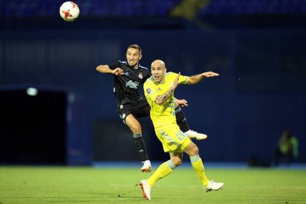 (180815) -- ZAGREB, Aug. 15, 2018 -- Marin Leovac (L) of GNK Dinamo Zagreb vies with Richard Almeida of FC Astana during the second leg of the 3rd round UEFA Champions League qualifying match in Zagreb, Croatia, on Aug. 14, 2018. GNK Dinamo Zagreb won 1-0. ) (SP)CROATIA-ZAGREB-SOCCER-UEFA CHAMPIONSHIP LEAGUE-QUALIFYING MATCH LukaxStanzl 