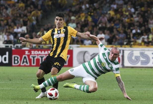 (180815) -- ATHENS, Aug. 15, 2018 -- AEK Athens Petros Mantalos (L) vies with Celtic s Scott Brown during the third round of Champions League qualifying match in Athens, Greece, Aug. 14, 2018. ) (SP)GREECE-ATHENS-SOCCER-CHAMPIONS LEAGUE-QUALIFIYING MariosxLolos 