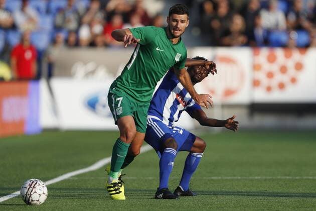 Rok Kronaveter 7, Olimpija Ljubljana, SVN and Anthony Annan 22, HJK Helsinki, FIN during their UEFA Champions League 3QR match HJK Helsinki - Olimpija Ljubljana in Telia 5G Arena 16. August 2018 in Helsinki, Finland.  Copyright: xKallexParkkinenx NP24_00328979