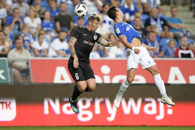 Genk s Sebastien Dewaest and Poznan s Vernon De Marco fight for the ball during a soccer game between Polish club Lech Poznan and Belgian team KRC Genk, Thursday 16 August 2018 in Poznan, Poland, the return leg of the third qualification round for the Europa League competition. YORICKxJANSENS  x05407068x