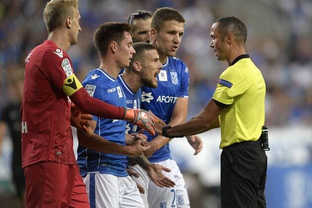Poznan s Pedro Tiba and Italian referee Marco Guida pictured during a soccer game between Polish club Lech Poznan and Belgian team KRC Genk, Thursday 16 August 2018 in Poznan, Poland, the return leg of the third qualification round for the Europa League competition. YORICKxJANSENS  x05407109x