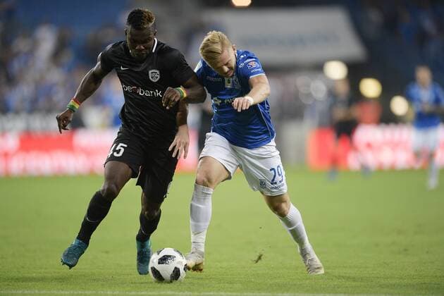 Genk s Joseph Aidoo and Poznan s Kamil Jozwiak fight for the ball during a soccer game between Polish club Lech Poznan and Belgian team KRC Genk, Thursday 16 August 2018 in Poznan, Poland, the return leg of the third qualification round for the Europa League competition. YORICKxJANSENS  x05407133x
