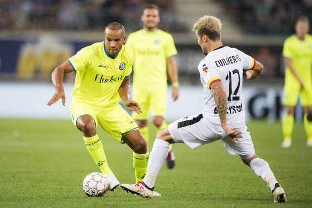 Gent s Vadis Odjidja-Ofoe and Jagiellonia s Guilherme Sitya fights for the ball during a soccer game between Belgian club KAA Gent and Polish team Jagiellonia Bialystok, Thursday 16 August 2018 in Gent, the return leg of the third qualification round for the Europa League competition. JASPERxJACOBS  x05407147x