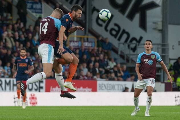Burnley v Istanbul Basaksehir F.K. UEFA Europa League Ben Gibson of Burnley in an aerial challenge with Riad Bajic of Istanbul Basaksehir during the UEFA Europa League match at Turf Moor, Burnley Content Not Available For UK Newspapers Copyright: xMattxWilkinsonx FIL-12169-0030