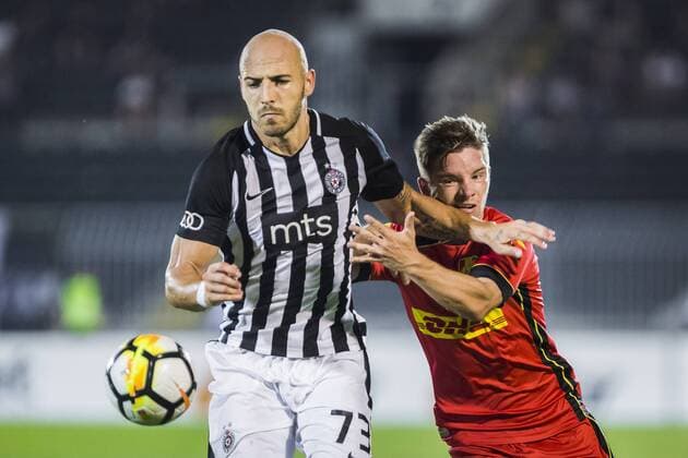 16th August 2018, Partizan Stadium, Belgrade, Serbia; Europa League football, third qualifying round 2nd leg, Partizan versus Nordsjaelland; Nemanja Miletic of Partizan shields the ball from Mads Pedersen of Nordsjaelland  ActionPlus12055911 NikolaxKrstic