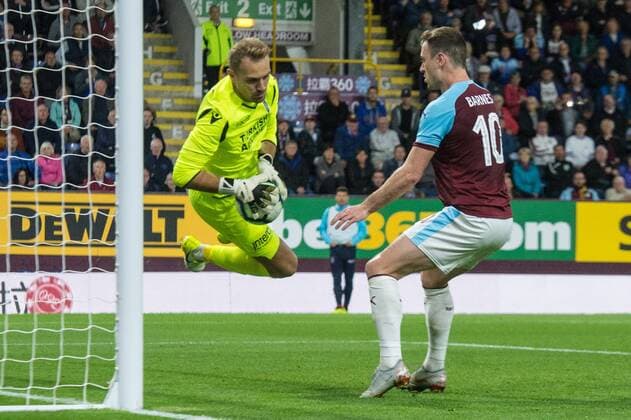 Burnley v Istanbul Basaksehir F.K. UEFA Europa League Istanbul Basaksehir goalkeeper Mert Gunok makes a save ahead of Ashley Barnes of Burnley during the UEFA Europa League match at Turf Moor, Burnley Content Not Available For UK Newspapers Copyright: xMattxWilkinsonx FIL-12169-0041