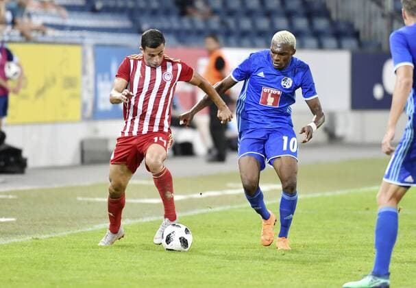 16 08 2018 Lucerne Switzerland Football Mens season 2018 2019 Europa League Qualifiers FC Luzern Olympiacos FC Pictured 14 Omar Elabdellaoui Olympiacos FC against Blessing Eleke FC Lucerne re action duel