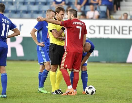 16 08 2018 Luzern Switzerland Soccer Men Season 2018 2019 Europa League Qualification FC Luzern Olympiacos FC Pictured Referee Kirill Levnikov RUS 7 Konstantinos Fortounis Olympiacos FC action