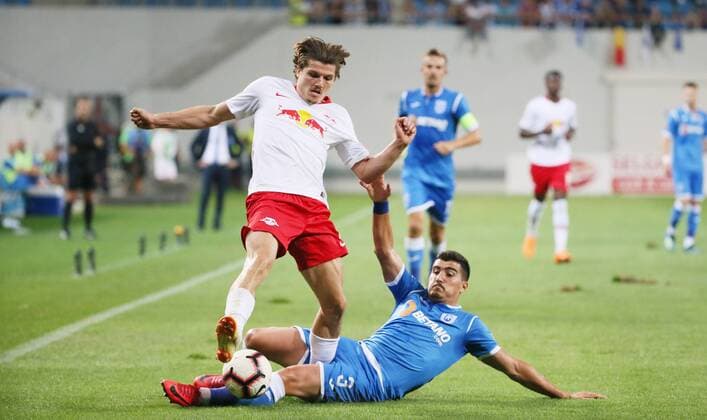 Craiova RB Leipzig Soccer Euro League Qualifiers Craiova 16 08 2018 Stadionul Ion Oblemenco Soccer UEFA Euro League Qualification 3 Round Return Match CS Universitatea Craiova vs. RB Leipzig 1 1 0 1 Pictured left Marcel Sabitzer 7 RB Leipzig Marius Briceag 3 Craiova