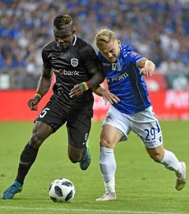 POZNAN,POLAND - AUGUST 16 : Kamil Jozwiak midfielder of Lech Poznan and Joseph Aidoo defender of KRC Genk pictured during the UEFA Europa League match,third qualifying round, 2 nd leg between KRC Genk and KKS Lech Poznan at the INEA Stadium on August 16, 2018 in Poznan, Poland 16 08 2018 FOOTBALL : KRC Genk vs KKS Lech Poznan - Ligue Europa Tour de Qualification - 16 08 2018 Photonews Panoramic 