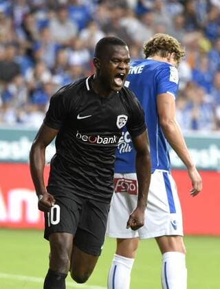 POZNAN,POLAND - AUGUST 16 : Ally Mbwana Samatta forward of KRC Genk celebrates with teammates after scoring pictured during the UEFA Europa League match,third qualifying round, 2 nd leg between KRC Genk and KKS Lech Poznan at the INEA Stadium on August 16, 2018 in Poznan, Poland 16 08 2018 FOOTBALL : KRC Genk vs KKS Lech Poznan - Ligue Europa Tour de Qualification - 16 08 2018 Photonews Panoramic 