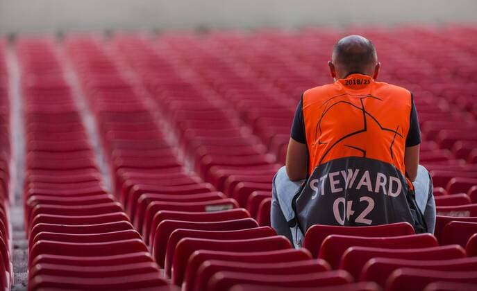 21st August 2018, Rajko Miti& x107; Stadium, Belgrade, Serbia; UEFA Champions League qualifier 1st leg, Red Star Belgrade versus Red Bull Salzburg; A steward sit quietly as the stadium is closed to fans for two games due to UEFA sanctions  ActionPlus12057358 NikolaxKrstic