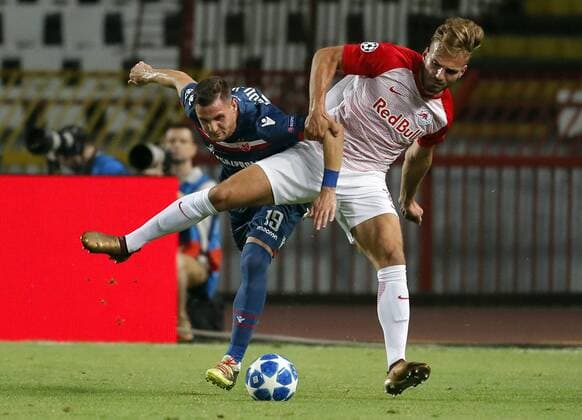 (180822) -- BELGRADE (SERBIA), Aug, 22, 2018 -- Salzburg s Marin Pongracic (R) vies with Crvena Zvezda s Nikola Stojiljkovic during the 1st leg of UEFA Champions League Play-offs football match between Crvena Zvezda and Salzburg in Belgrade, Serbia on Aug. 21, 2018. The match ended in a 0-0 draw. ) (SP)SERBIA-BELGRADE-FOOTBALL-UEFA-QUALIFICATION-CRVENA ZVEZDA VS SALZBURG PredragxMilosavljevic 
