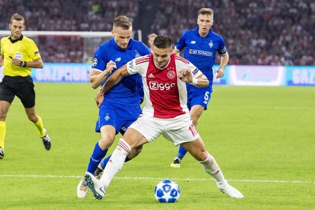 AMSTERDAM, Netherlands, 22-08-2018, football, season 2018 2019, Champions League Play-offs , Johan Cruijff ArenA , Dynamo Kiev player Tomasz Kedziora and Ajax player Dusan Tadic during the match Ajax - Dynamo Kiev Ajax - Dynamo Kiev  x2413756x