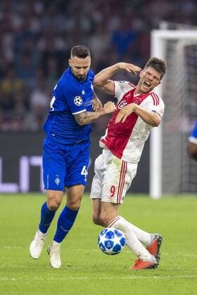 AMSTERDAM, Netherlands, 22-08-2018, football, season 2018 2019, Champions League Play-offs , Johan Cruijff ArenA , Dynamo Kiev player Tamas Kadar and Ajax player Klaas Jan Huntelaar during the match Ajax - Dynamo Kiev Ajax - Dynamo Kiev  x2413887x