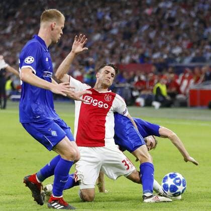 AMSTERDAM, Netherlands, 22-08-2018, football, season 2018 2019, Champions League Play-offs , Johan Cruijff ArenA , Ajax-player Nico Tagliafico getting sandwiched during the match Ajax - Dynamo Kiev 3-1 . Ajax - Dynamo Kiev  x2413901x