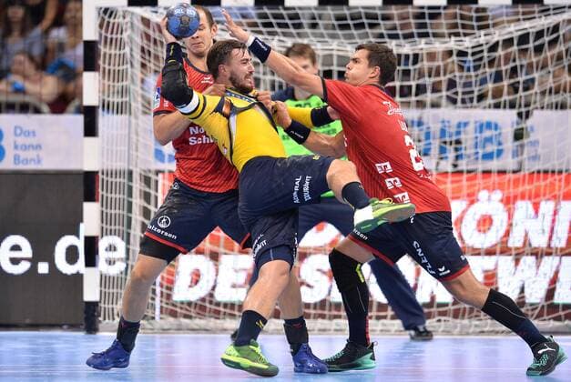 Handball Pixum Super Cup SG Flensburg Handewitt Rhein Neckar Löwen on 22 08 2018 at the ISS Dome in Düsseldorf Simon Hald Flensburg left Jannik Kohlbacher Rhein Neckar Löwen middle Rasmus Lauge Flensburg right xTTx