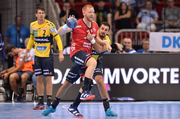 Handball Pixum Super Cup SG Flensburg Handewitt Rhein Neckar Löwen on 22 08 2018 at the ISS Dome in Dusseldorf Jim Gottfridsson Flensburg in front Ilija Abutovic Rhine Neckar Löwen behind xTTx
