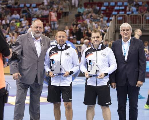 Pixum Super Cup in Dusseldorf 22 8 2018 Pixum Super Cup in Dusseldorf 22 8 2018 SG Flensburg Handewitt vs Rhein Neckar Löwen Andreas Michelmann DHB President with the best referees of the season Peter Behrens and Marc Fasthoff Neuss on the right Wolfgang Jamelle DHB referee attendant
