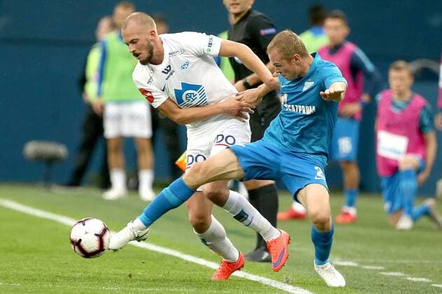 ST PETERSBURG, RUSSIA â€“ AUGUST 23, 2018: FC Molde s Eirik Hestad (L) and FC Zenit St Petersburg s Alexander Anyukov in action in Leg 1 of their 2018â€“19 UEFA Europa League play-off round football match at Saint Petersburg Stadium. Peter Kovalev TASS  TS08DB8F