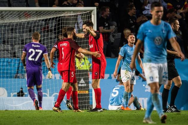 180823 Marc Dal Hende or Midtjylland celebrates the 2 2 goal behind goalkeeper Johan Dahlin or Malmö FF during the UEFA Europe League qualifying match between Malmö FF and Midtjylland on August 23, 2018 in Malmö Photo Ludvig Thunman BILDBYR N code LT 35525  Copyright: LUDVIGxTHUNMAN BB180823LT067
