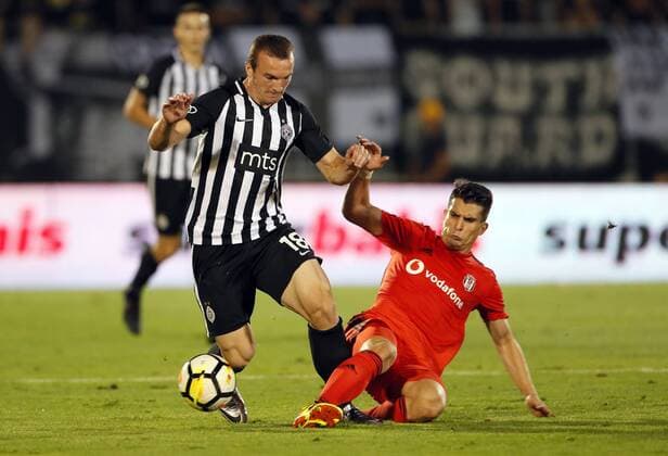 (180824) -- BELGRADE, Aug. 24, 2018 -- Djordje Ivanovic (L) of Partizan vies with Necip Uysal of Besiktas during the first leg match of UEFA Europa League play-offs in Belgrade, Serbia, Aug. 23, 2018. The match ended in a 1-1 draw. ) (SP)SERBIA-BELGRADE-UEFA EUROPA LEAGUE PLAY-OFF-PARTIZAN VS BESIKTAS PredragxMilosavljevic 