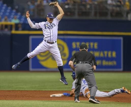 August 23, 2018 - St. Petersburg, Florida, U.S. - CHRIS URSO Times.Tampa Bay Rays shortstop Willy Adames (1) leaps to make the stop on the ball as Kansas City Royals second baseman Whit Merrifield (15) slides safely into second base on a steal attempt in the third inning Thursday, Aug. 23, 2018 in St. Petersburg. Florida News - August 23, 2018 - ZUMAs70_ 85099693st Copyright: xChrisxUrsox
