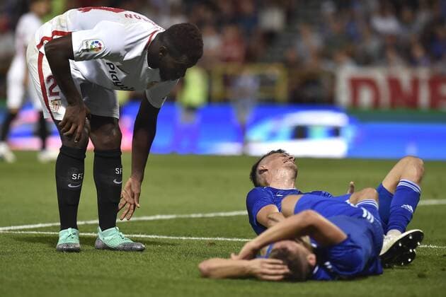 L-R Joris Gnagnon (Sevilla), Lukas Kalvach and Jan Sterba (both Olomouc) are seen during the European League qualification match SK Sigma Olomouc vs Sevilla in Olomouc, Czech Republic, August 23, 2018. (CTKxPhoto JaroslavxOzana) CTKPhotoP201808230993201  JAO 14