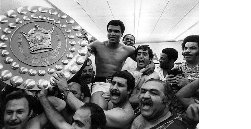 TOKYO --JUNE 23-- CHANTING ALI, ALI , A GROUP OF IRANIAN WRESTLERS HOIST THE WORLD HEAVYWEIGHT BOXING CHAMPION MUHAMMAD ALI ON THEIR SHOPULDERS AT A TOKYO GYM ON JUNE 21 AFTER ALI FINISHED A SIX-ROUND TRAINING SESSION FOR HIS JUNE 26 WORLD MARTIAL ARTS TITLE BOUT AGAINST JAPANESE PRO WRESTLER ANTONIO INOKI. PAYING Y 2.OOO ($6.7O), JAPANESE FANS PACKED THEMSELVES ELBOW TO ELBOW IN A TINY TOKYO GYMNASIUM TO WATCH ALI SHADOW BOX, SPAR, SLIP AND JUMP ROPE. . .JEP WST BELGA  x85106618stx