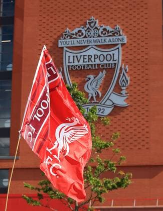 25th August 2018, Anfield, Liverpool, England; EPL Premier League football, Liverpool versus Brighton and Hove Albion; the Liverpool club flag flutters in the breeze outside the main stand before the match  ActionPlus12058065 DavidxBlunsden