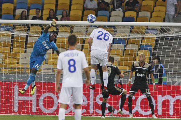 August 28, 2018 - Kiev, Ukraine - MYKYTA BURDA (C) of Dynamo and ANDRE ONANAD (L) of Ajax in action during the UEFA Champions League play-off, second leg, soccer match between FC Dynamo Kyiv and Ajax Amsterdam, at the Olimpiyskiy stadium in Kiev, Ukraine, on 28 August 2018. Ajax Amsterdam vs FC Dynamo Kiev , UEFA Champions League soccer match - ZUMAg194 20180828_zap_g194_009 Copyright: xSergxGlovnyx