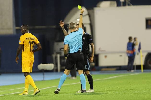 Zagreb, 28 08 2018 - Stadion Maksimir, UEFA Champions League - 2018 19, GNK Dinamo (blue) - BSC Young Boys (yellow) 1:2, Nicolas Moumi Ngamaleu (13), Petar Stojanovic (30) and referee Bjorn Kuipers (NED) 