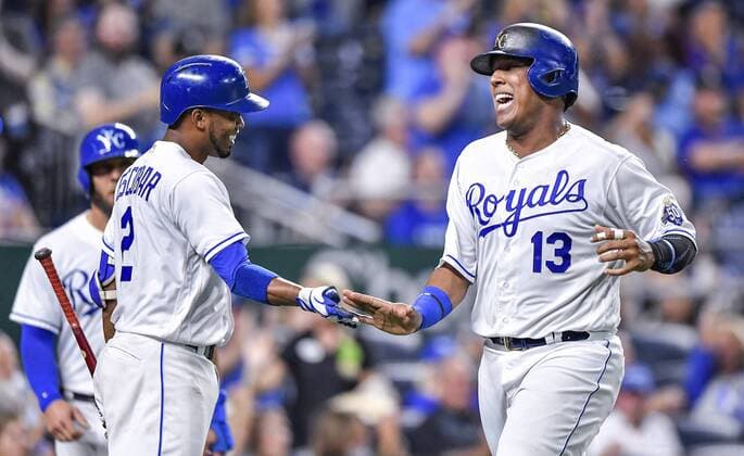 August 28, 2018 - Kansas City, MO, USA - The Kansas City Royals Salvador Perez (13) is greeted by Alcides Escobar after Perez scored on a two-run double by Hunter Dozier in the third inning against the Detroit Tigers at Kauffman Stadium in Kansas City, Mo., on Tuesday, Aug. 28, 2018. Detroit at Kansas City - ZUMAm67_ 20180828_zaf_m67_033 Copyright: xJohnxSleezerx