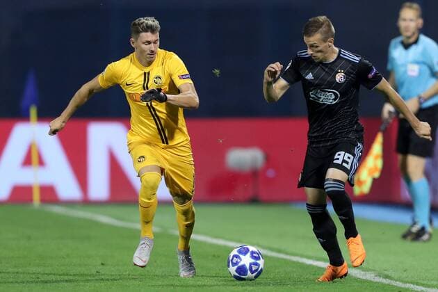 (180829) -- ZAGREB, Aug. 29, 2018 -- Mislav Orsic (R) of GNK Dinamo Zagreb vies with Christian Fassnacht of BSC Young Boys during UEFA Champions League play-off match in Zagreb, Croatia, on Aug. 28, 2018. Young Boys won 2-1. ) (SP)CROATIA-ZAGREB-FOOTBALL-UEFA CHAMPIONS LEAGUE LukaxStanzl 