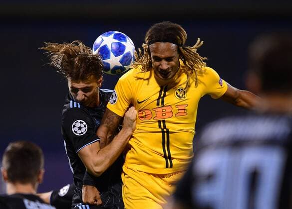 (180829) -- ZAGREB, Aug. 29, 2018 -- Ivan Sunjic (L) of GNK Dinamo Zagreb vies with Kevin Mbabu of BSC Young Boys during UEFA Champions League play-off match in Zagreb, Croatia, on Aug. 28, 2018. Young Boys won 2-1. Marko Prpic) (SP)CROATIA-ZAGREB-FOOTBALL-UEFA CHAMPIONS LEAGUE LukaxStanzl 