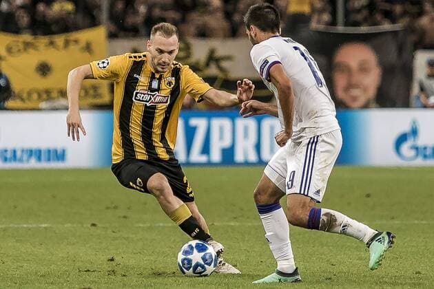 (180829) -- ATHENS, Aug. 29, 2018 -- AEK s Michalis Bakakis (L) vies with MOL Vidi s Boban Nikolov during the Champions League Play-Off leg 2 soccer match between AEK Athens and MOL Vidi FC at Olympic Stadium in Athens, Greece, on Aug. 28, 2018. ) (SP)GREECE-ATHENS-SOCCER-CHAMPIONS LEAGUE-AEK ATHENS VS MOL VIDI FC PanagiotisxMoschandreou 