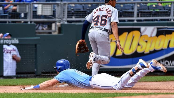 August 29, 2018 - Kansas City, MO, USA - Kansas City Royals Hunter Dozier slides into third as Detroit Tigers third baseman Jeimer Candelario chases after the throw on a triple in the fourth inning on Wednesday, Aug. 29, 2018 at Kauffman Stadium in Kansas City, Mo. Detroit Tigers vs. Kansas City Royals - ZUMAm67_ 20180829_zaf_m67_022 Copyright: xJohnxSleezerx