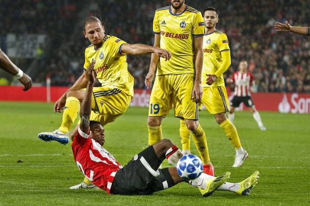 EINDHOVEN, Netherlands, 29-08-2018, football, Champions League play-off round 4 leg 2 , season 2018 2019 , PSV Philips Stadium , PSV - BATE Borisov , Borisov player Aleksandar Filipovic (L) and PSV defender Denzel Dumfries (R) during the game PSV - BATE Borisov . PSV - Borisov  x2432810x