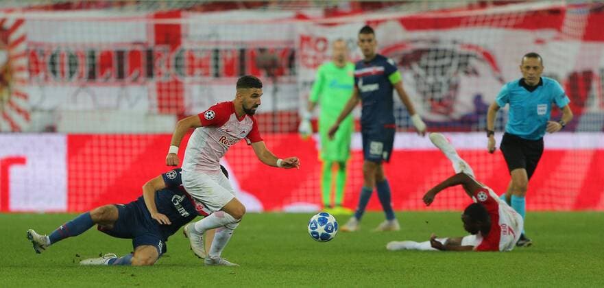 SOCCER - CL quali, RBS vs Belgrade SALZBURG,AUSTRIA,29.AUG.18 - SOCCER - UEFA Champions League qualification play-off, Red Bull Salzburg vs FC Red Star Belgrade. Image shows Munas Dabbur (RBS), Dusan Jovancic (Belgrade) and Reinhold Yabo (RBS). GEPAxpictures xThomasxBachun